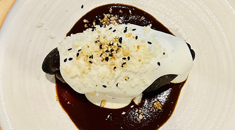 Cozobi Fonda Fina signature dishes Mole Negro, Tlayudas, Pozole Verde, Cochinita Pibil